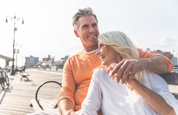 Happy senior couple spending time at the beach.
