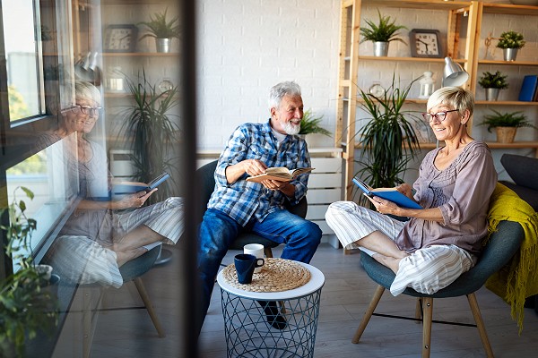 Happy senior couple in love hugging and bonding with true emotions at home